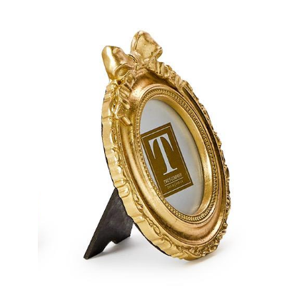 Gold decorative frame with a stand on a white background