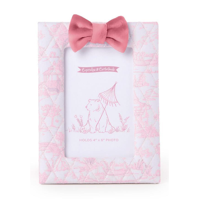 


Pink photo frame with bow and floral pattern on a white background