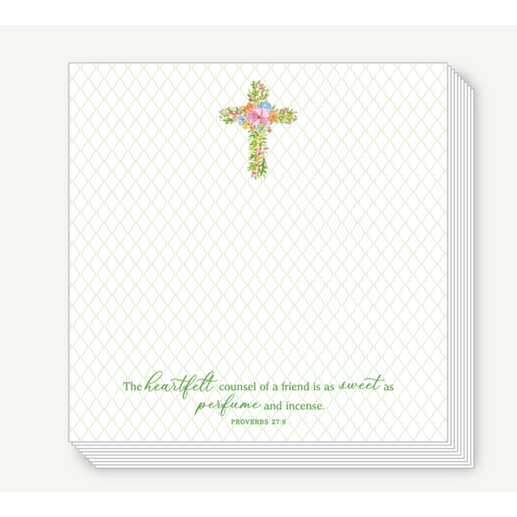 Notebook with floral cross design and text on a white background