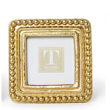 


Gold decorative frame with a visible brand logo on a white background