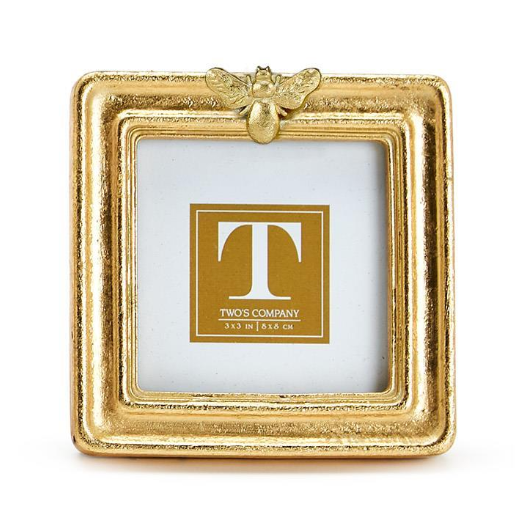 Gold picture frame with 'T' logo and 'Two's Company' text on a white background