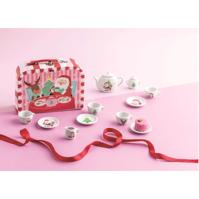 Tea set with Santa Claus design on a pink background