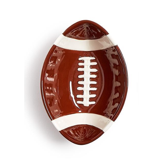 Football-shaped plate with brown and white design on a white background