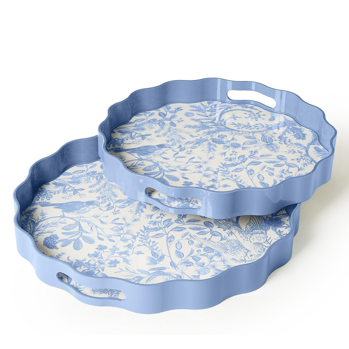 Two scalloped-edge serving trays with blue handles, featuring a blue floral toile pattern on a white background, shown on a white studio background.