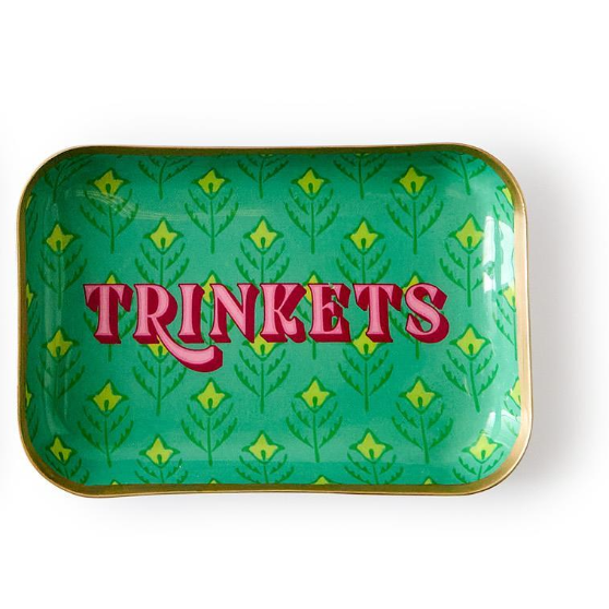 Green decorative tray with 'TRINKETS' text and leaf pattern