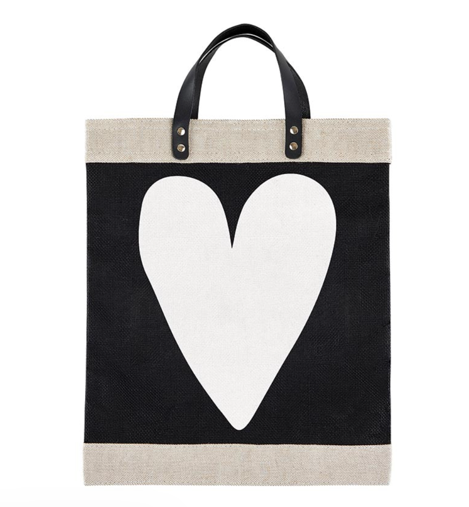 Tote bag with a white heart design on a black background