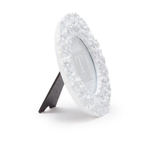 Decorative photo frame with a textured white design on a white background