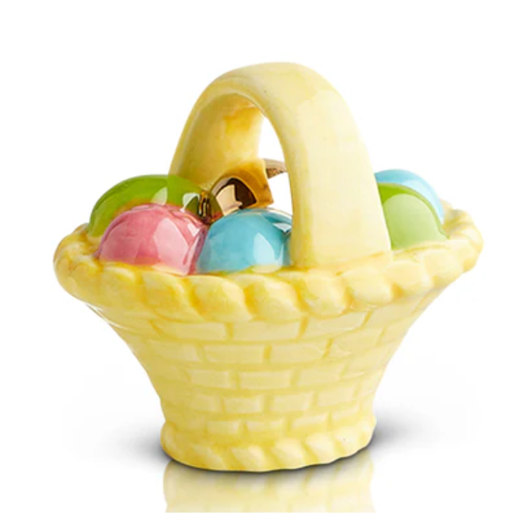 Yellow ceramic Easter basket with colorful eggs on a white background