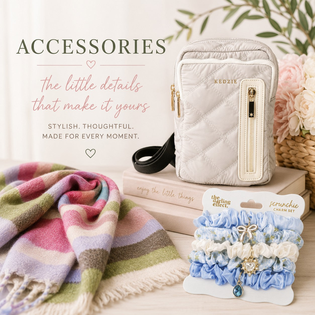 A styled accessories display featuring a cream quilted crossbody bag with gold hardware, a pastel striped knit blanket, a pack of blue and white scrunchies with a charm, and promotional text reading 'ACCESSORIES'.