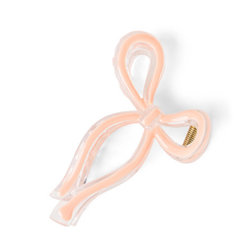Neon light shaped like a pink ribbon on a white background