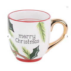 Mug with a red cardinal and green leaves design on a white background