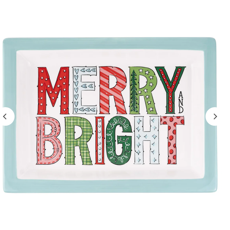 Decorative sign with 'Merry and Bright' text in colorful letters on a light blue background.