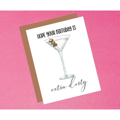 Greeting card with a martini glass illustration and humorous birthday message on a pink background