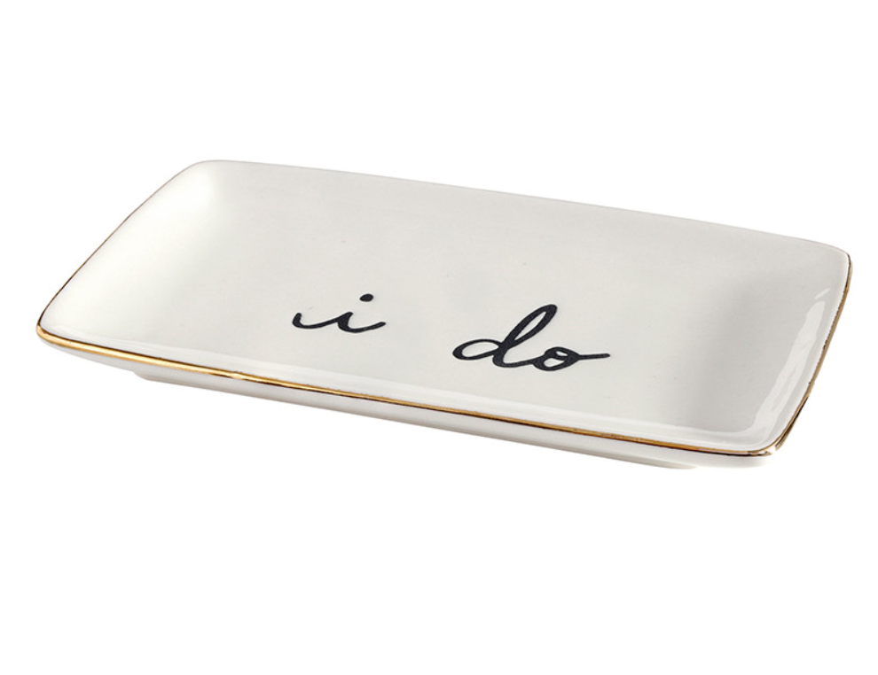 White trinket dish with 'i do' text on a white background