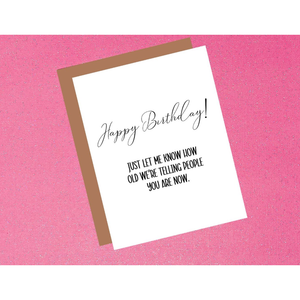 Birthday card with humorous text on a pink background