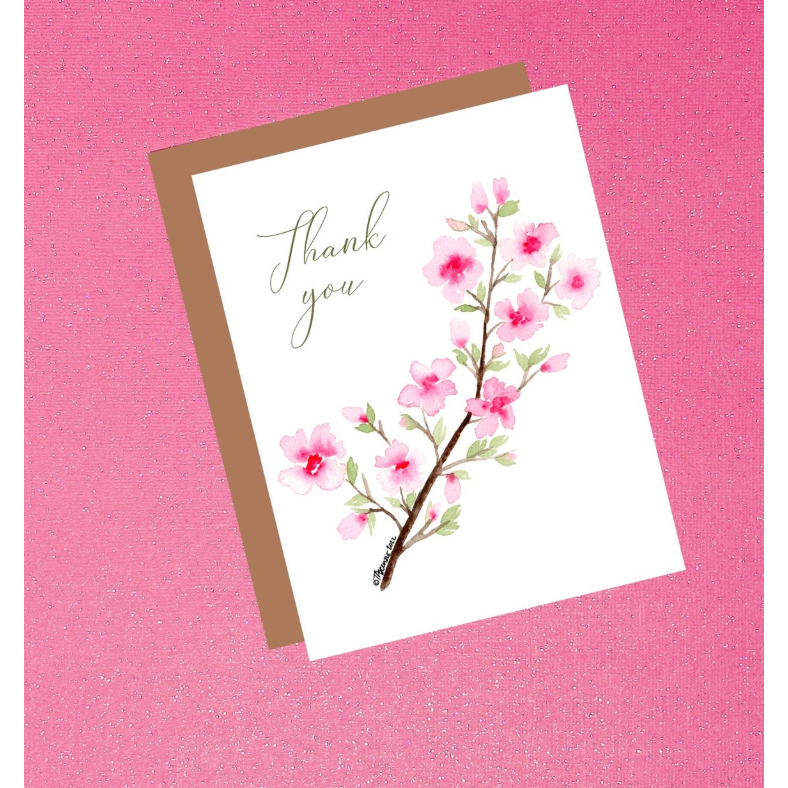 Greeting card with cherry blossom design and 'Thank you' text on a pink background