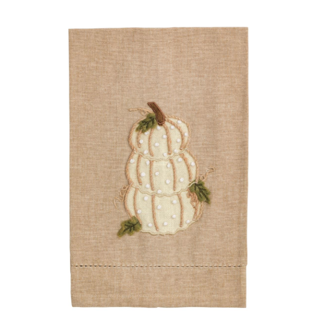 Decorative towel with a white pumpkin design on a beige background