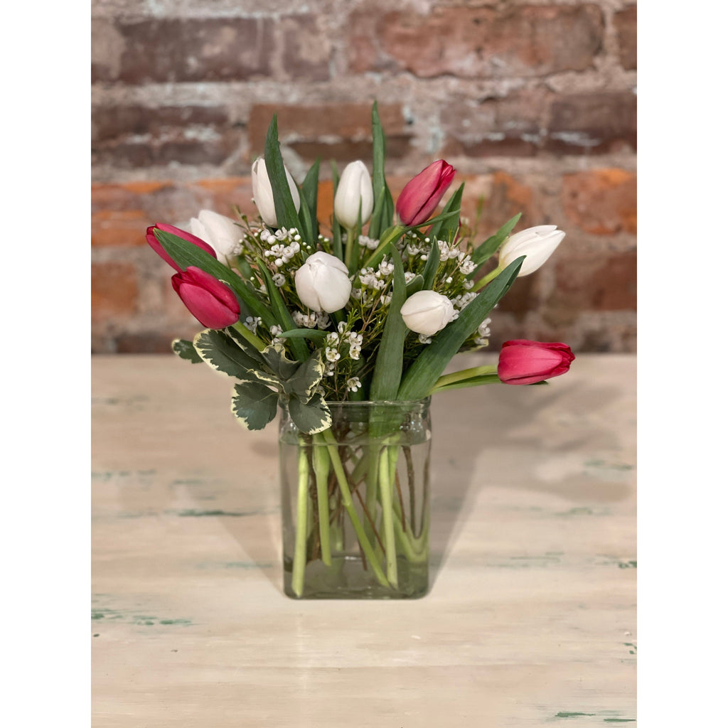 dozen tulip arrangement in a vase