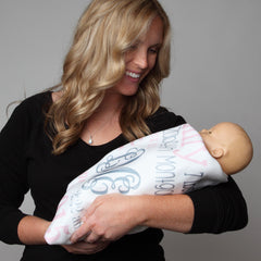 Baby wrapped in personalized blanket