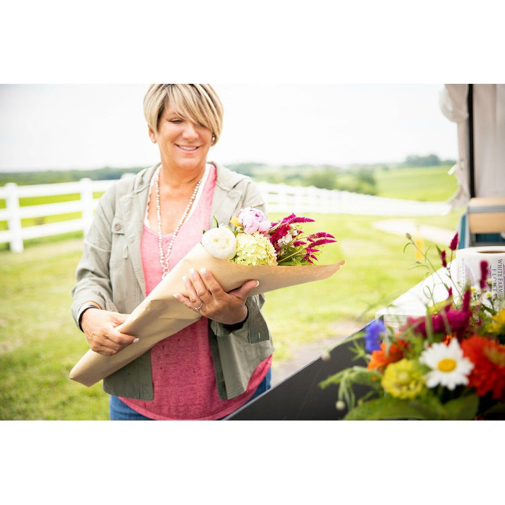 Denise with wrapped bouquet